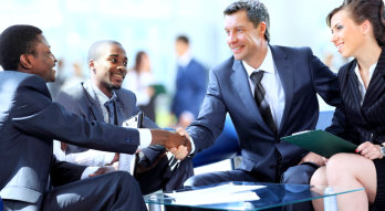 group of business are shaking their hand while having a negotiation